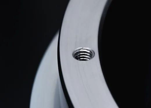 A threaded hole in a machined steel ring